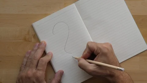 Man write large question symbol at blank page of organizer book, using pencil Stock Footage 91099501