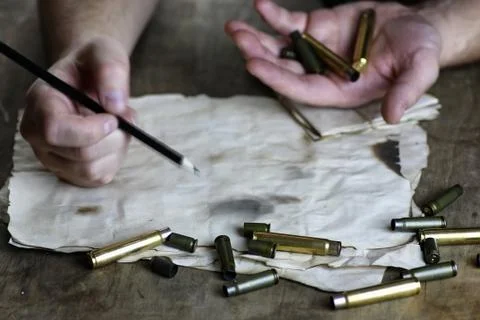 Man write letter retro bullet on the table Stock Photos