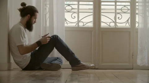 Man write on paper sitting on floor 動画素材 64570905