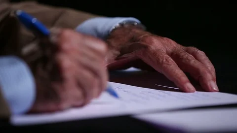 Man writes in Arabic on a white paper Stock Footage 119907654