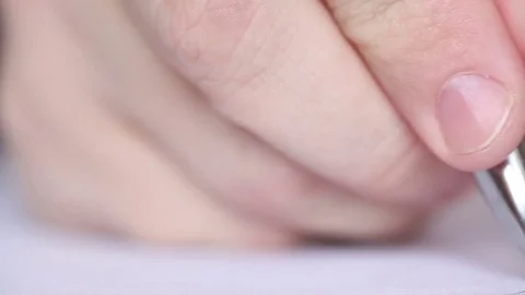 Man writes with a ballpoint pen. Macro shooting Video stock 72561395