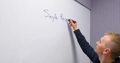 A man writes on the board plans for the day for employees and colleagues Stock Footage 274094227