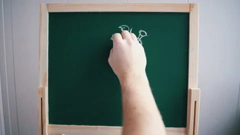 A man writes on the board a "stop coronavirus" Stock Footage 142606466