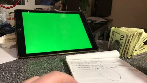 A man writes a to-do list in a notebook. hromakey Stock Footage 103463495