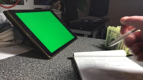 A man writes a to-do list in a notebook. hromakey Stock-Footage 103463614