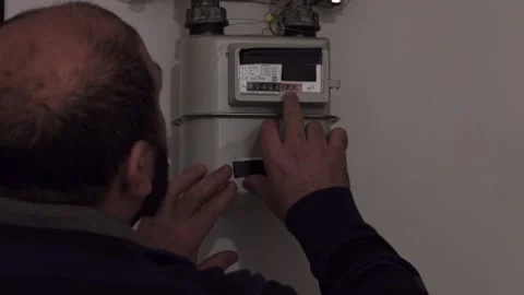 Man Writes Down The Gas Meter Stock Footage 170304971