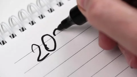 Man writes down numbers new year 2024 with marker and underlines them. closeup. Stock Footage 256076080