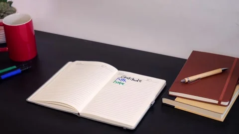 Man Writes Gratitude Lists in Journal with Markers Video stock 325447367