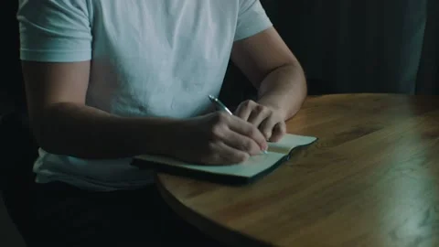 Man writes ideas in a notebook Stock-Footage 131398789