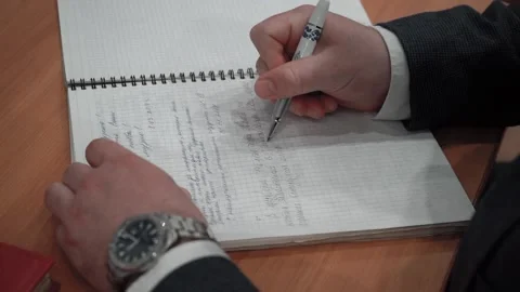A man writes information in a notebook Stock Footage 130751242