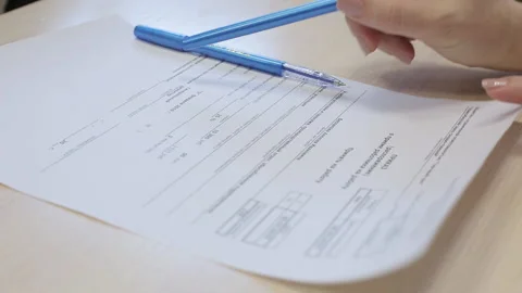 Man writes information on a worksheet (imitation, layout) Stock Footage 132230612