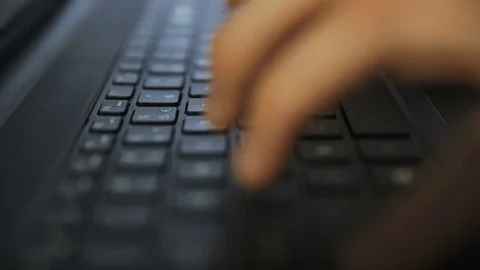 Man writes on a laptop keyboard Stock-Footage 76165245