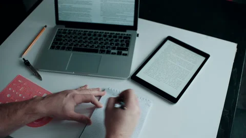 Man writes lectures in his notebook Stock Footage 142689432
