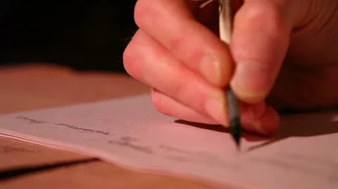 Man writes a letter to feather 1 Stock Footage 22984199