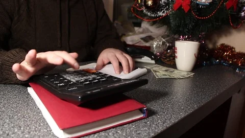 Man writes a list of gifts Stock Footage 100753940