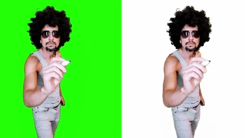 A man writes with a marker on a virtual board on a green background Stock-Footage 303141994