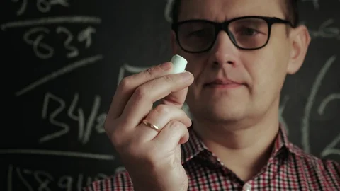 Man writes math formula on blackboard Stock Footage 128334891