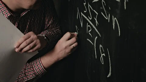 Man writes math formula on blackboard Stock Footage 128334924