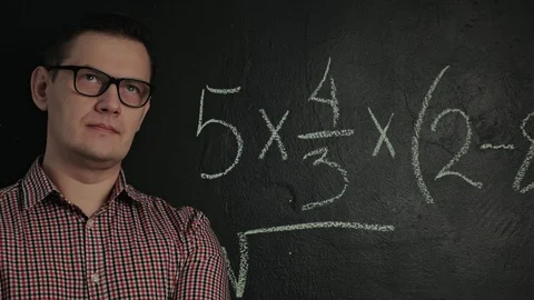 Man writes math formula on blackboard Stock Footage 128337248