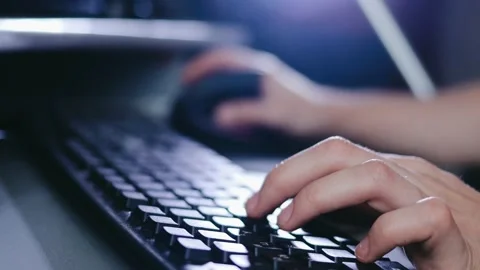 A man writes a message, a hacker enters the PC virus code on the keyboard lat Stock Footage 148160113