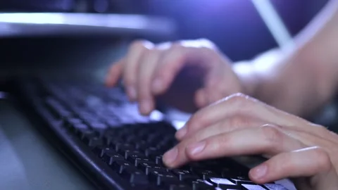 A man writes a message, a hacker enters the PC virus code on the keyboard Stock Footage 148160205