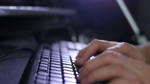 A man writes a message, a hacker enters the PC virus code on the keyboard Stock Footage 148160282