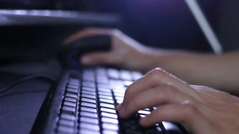 A man writes a message, a hacker enters the PC virus code on the keyboard Stock Footage 148160285