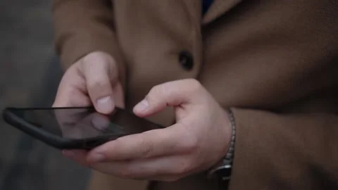 Man writes a message on a smartphone Stock Footage 150230096