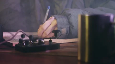 Man writes in notebook and sends signal by telegraph Video stock 230224563