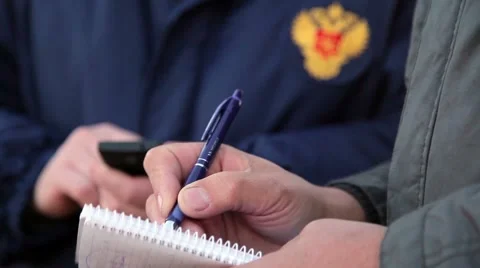 The man writes in a notebook. Close-up Stock Footage 54234358