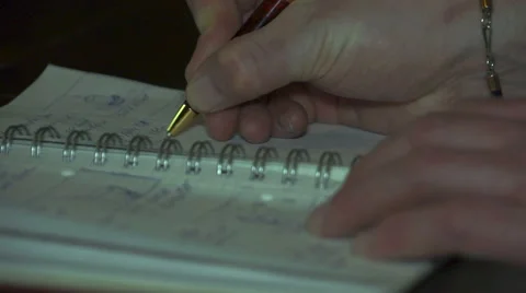 Man writes in the notebook. Hand and pen close-up. Stock Footage 62500435