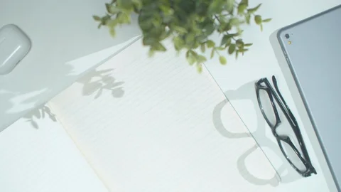 A man writes in a notebook. Top view Stock Footage 129966515