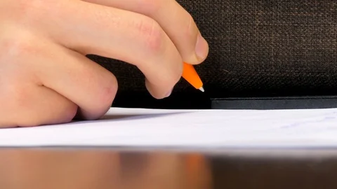 Man Writes Notes On Piece of Paper Stock Footage 98037048