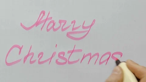 Man writes on paper Marry Christmas Stock Footage 80719778