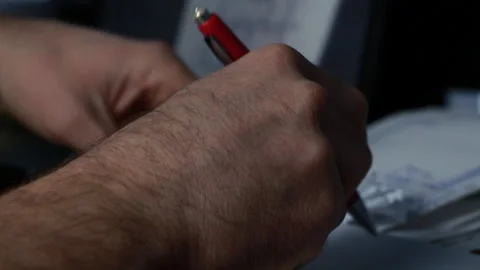 A man writes on paper, the project datae Stock Footage 86000397