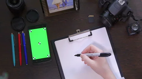 A man writes a pen on paper word idea Stock Footage 61342829