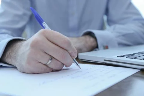 A man writes with a pen Stock Photos