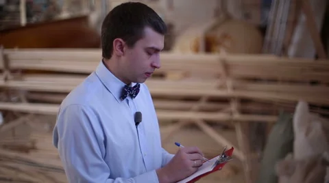 Man writes a pen on a piece of paper Stock Footage 60224685
