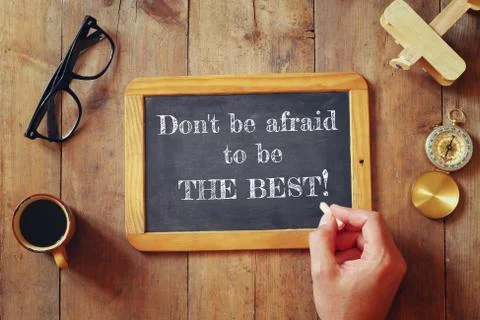Man writes a phrase: DON'T BE AFRAID TO BE THE BEST Stock Photos