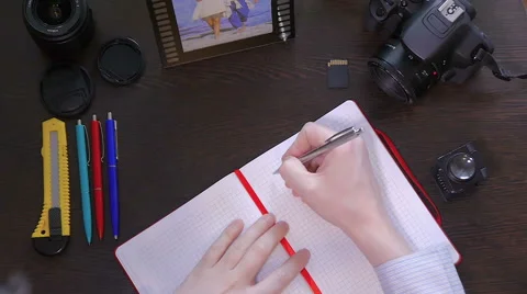 A man writes smile a pen in notebook Stock-Footage 61343735