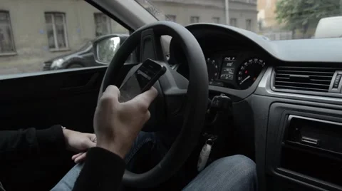 Man writes SMS while driving. Stock Footage 52068022