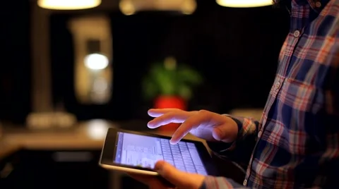 Man Writes in the Social Network on the Tablet on a Beautiful Background Stock Footage 48675586