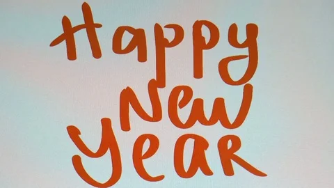 Man writes on a tablet of a happy new year Stock Footage 80718846