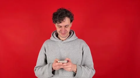 Man writes text message, comments on mobile phone, texts in messengers. Stock Footage 304748619