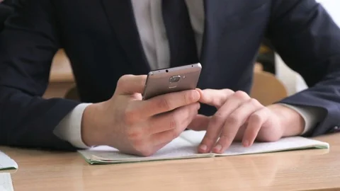 Man writes text using the smartphone. Close-up Видео 78649982
