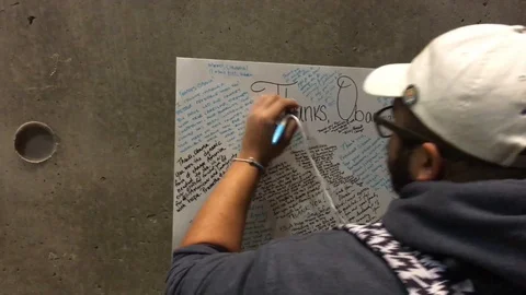 Man writes "Thank You" note to Obama. Stock Footage 125867570