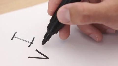 A man writes the words I voted on a piece of paper. US presidential election Stock Footage 282025604