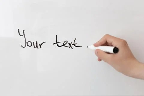 A man writes your text on a white board Stock Photos