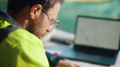 Man, writing and engineer on site for planning, urban development and project Stock Footage 336197781