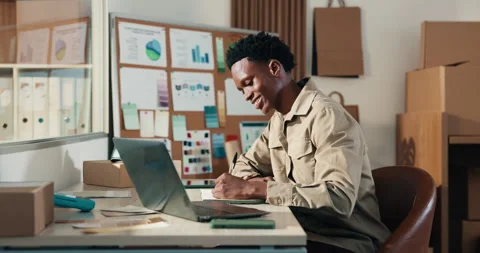Man, writing and logistics with laptop in small business, research and checking Stock Footage 346215153